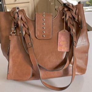 Brown leather bag New with several pockets and detachable wallet.